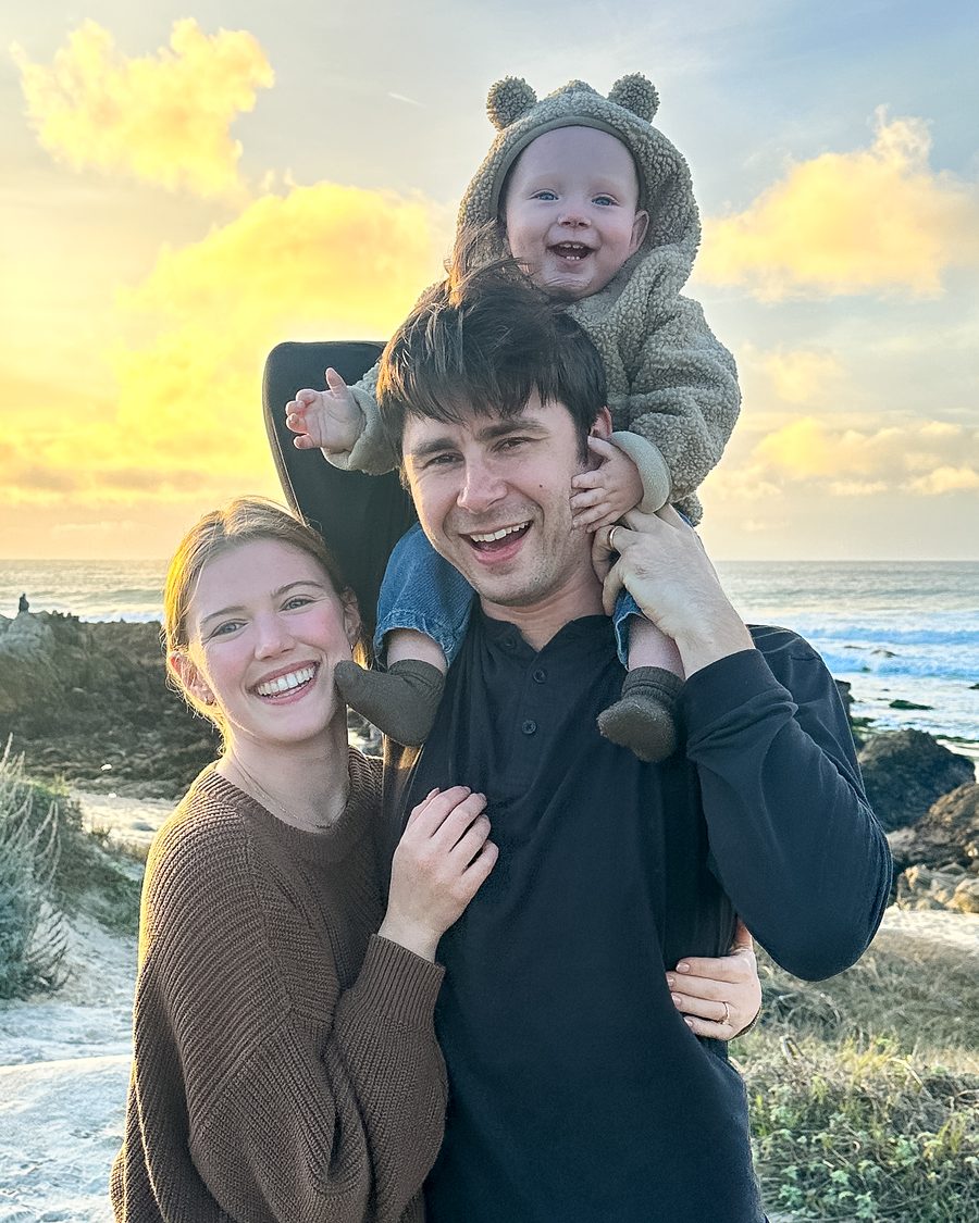 Cassie Stone with her family on the beach at sunset